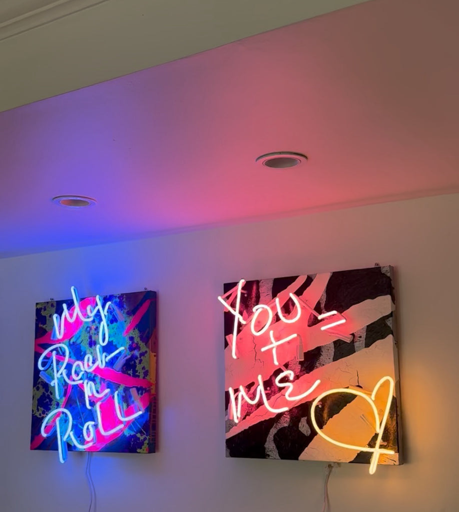 Handcrafted cobalt blue neon sign glowing on graffiti-inspired canvas – rock and roll wall art for music lovers