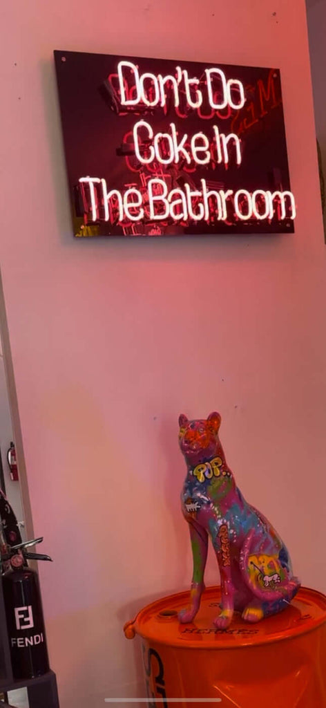 Don't Do neon sign wall art in hot pink, vibrant and witty catchphrase, illuminated, stylish home decor.