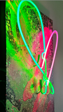 Two-tone neon heart wall décor with split pink and green neon glow